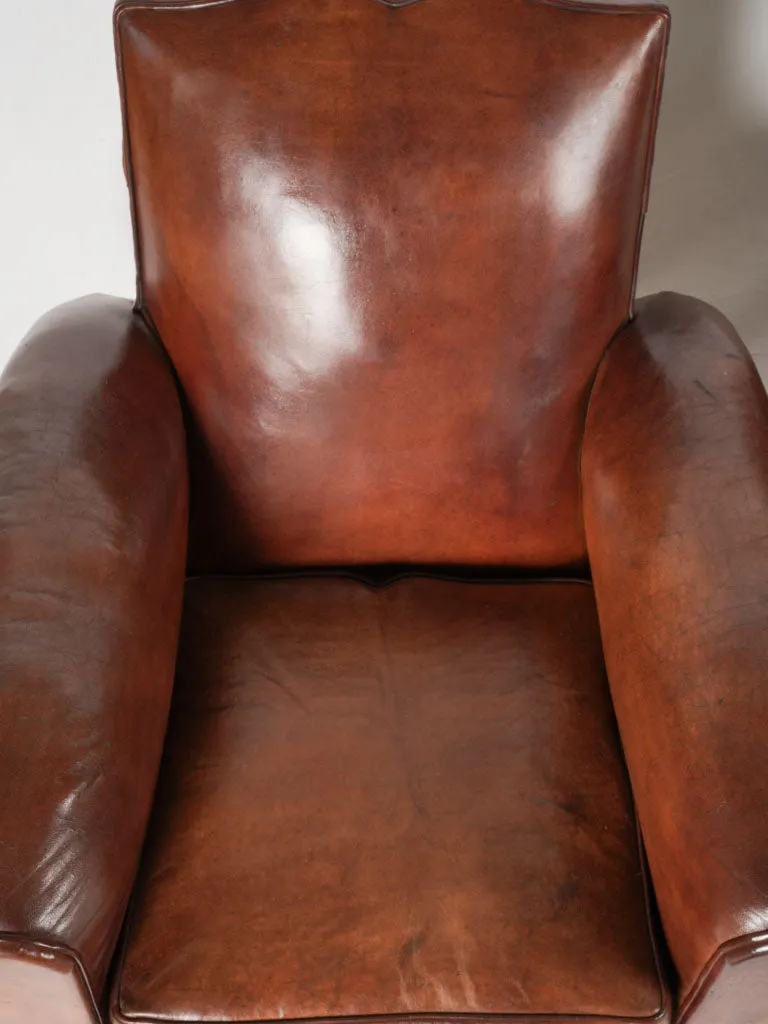 Pair of antique French leather club chairs - moustache back